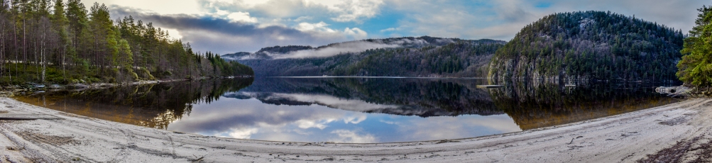 I wanted one photo that captured all the reflections and the small beach at the lake Ytre Øydnavatnet in the south of Norway. I took a series of photos and merged them together to a very detailed panorama image.