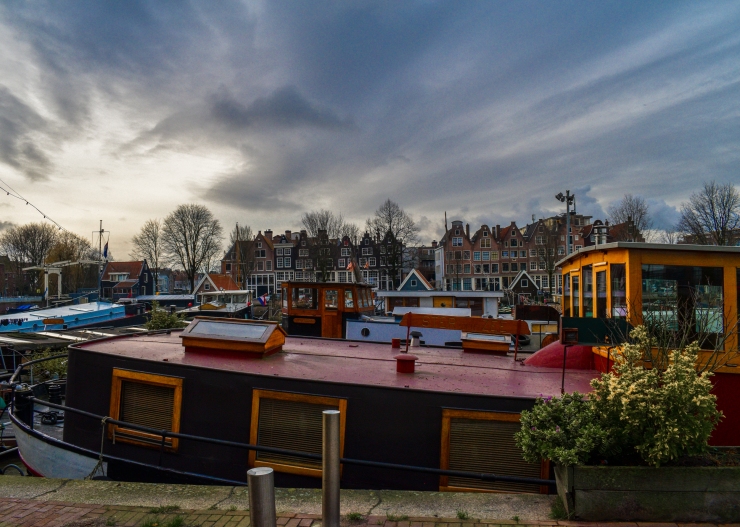 Light reflecting on a houseboat at Westerdok in Amsterdam