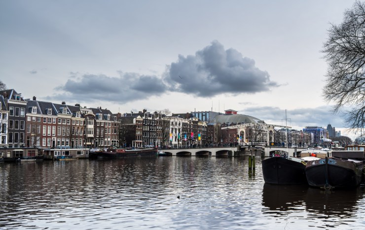 View of the Magere Brug and the old townhouses along the Amstel Canal in Amsterdam.