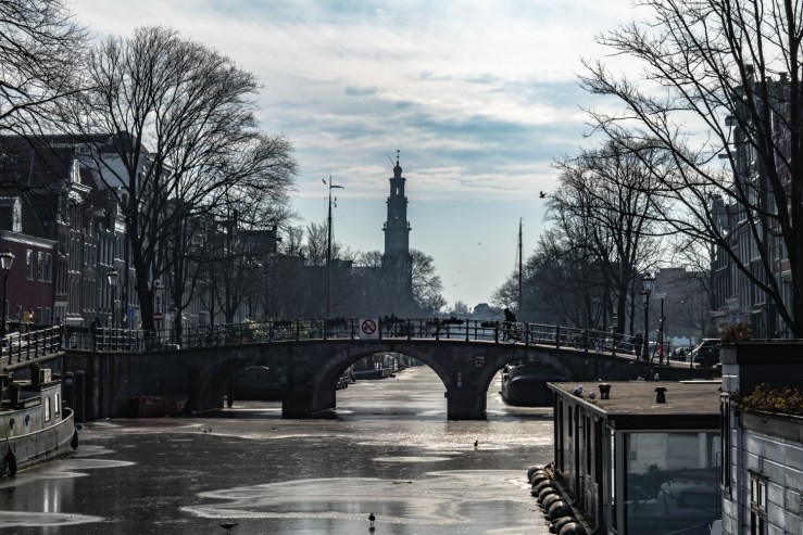 Frozen canal in Amsterdam. I used a polarizer filter for this photo.